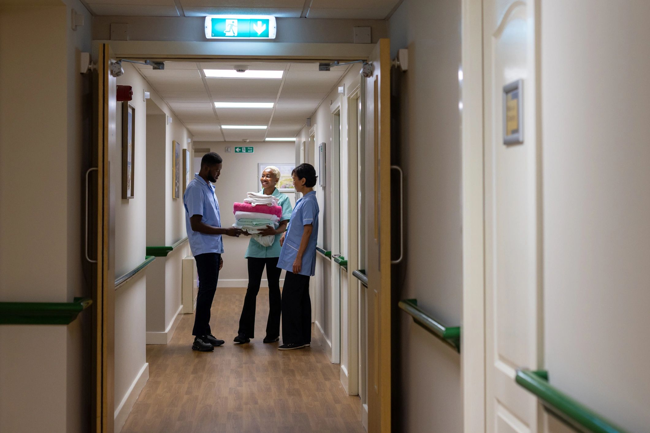 Healthcare staff in a facility corridor